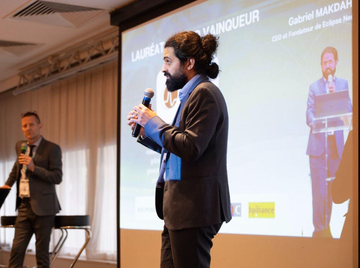 Dr. Gabriel Makdah pitching Eclipse NeuroTech on stage at Medi'Nov Connection 2026 in Lyon